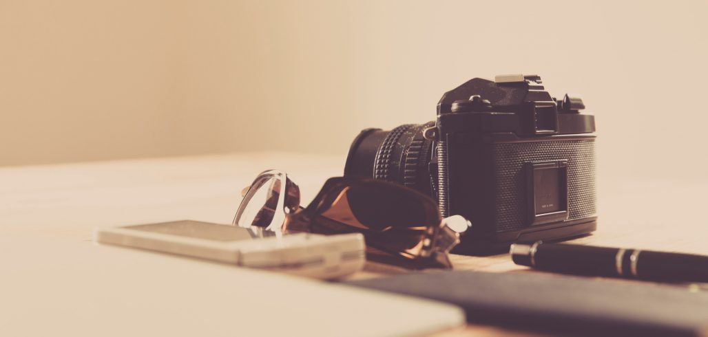 Camera and notebook representing digital media skills