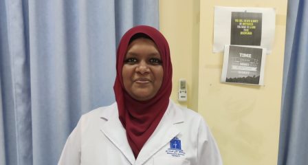 Aishath Majidha Hassan wearing a laboratory coat